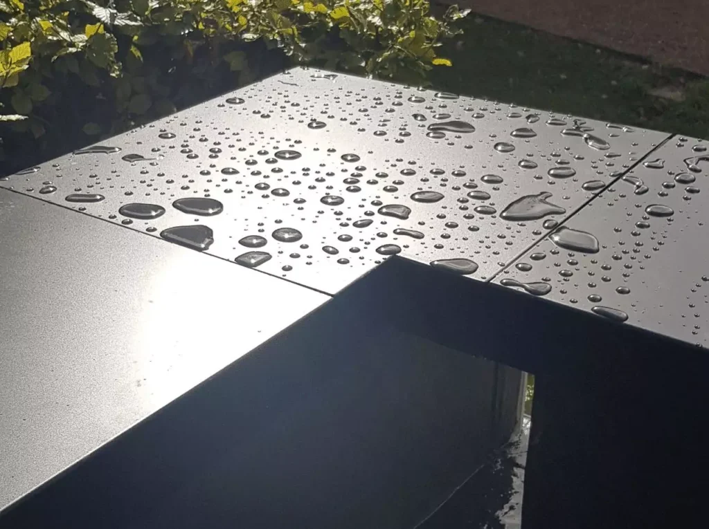 Raindrops on aluminium coping corner, Henley on Thames