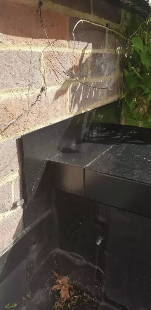 Brick wall detail with aluminium coping installed