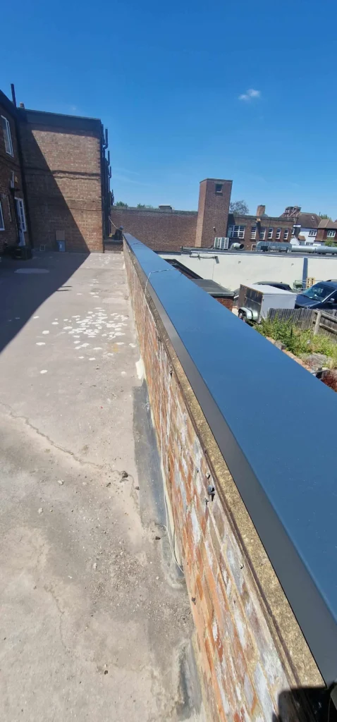 Completed aluminium coping providing a sleek and durable brick wall finish